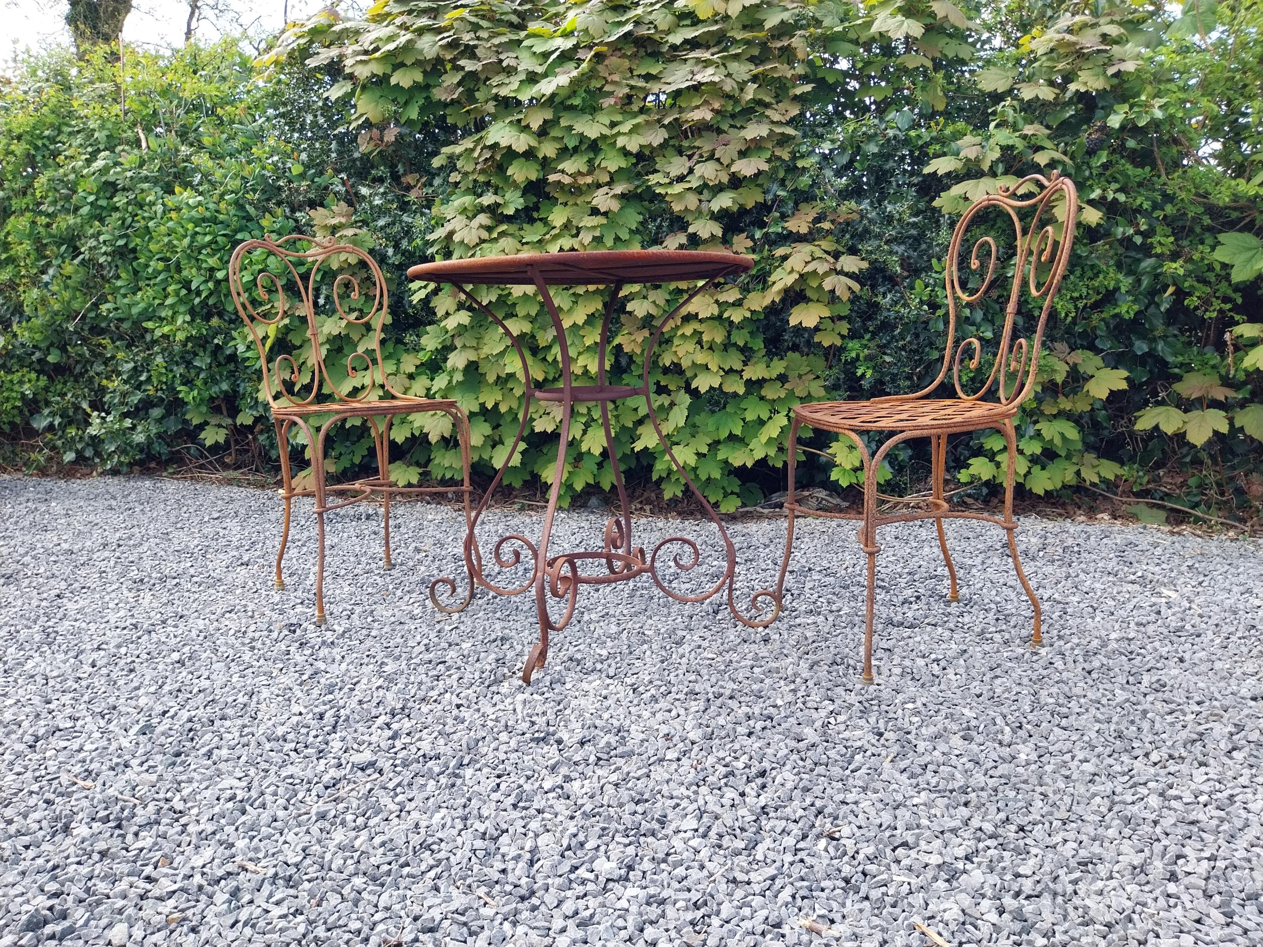 Wrought iron café - garden circular table with two matching chairs {Tbl. 75 cm H x 70 cm Dia. Chairs - Image 4 of 10