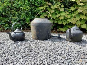 Cast iron boiler and two cast iron kettles {38 cm H, 29 cm H and 34 cm H}.