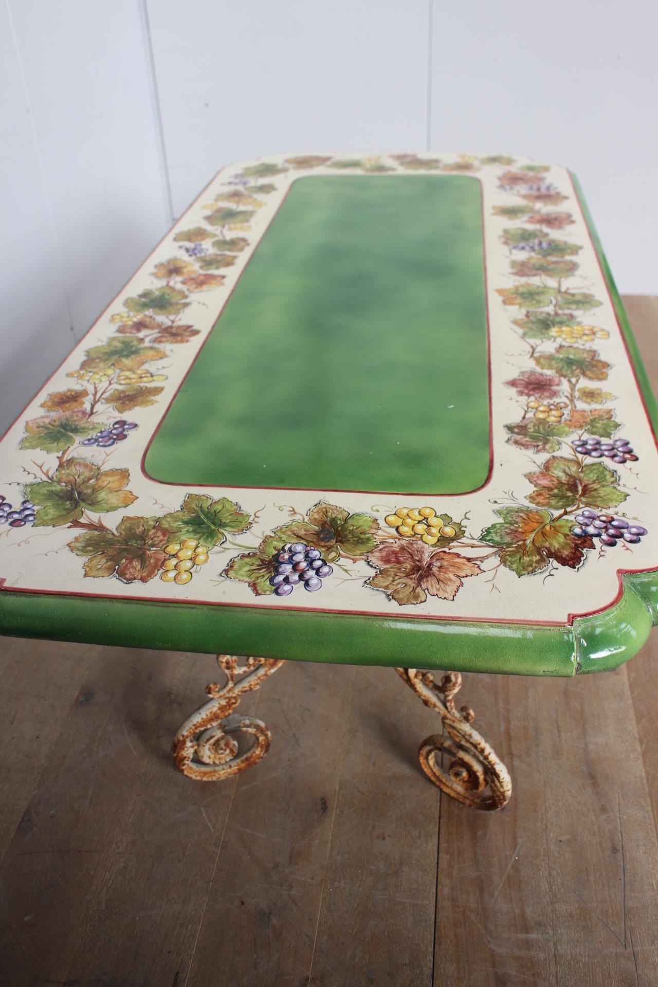 Handmade and hand painted ceramic table raised on cast iron scroll base {H 79cm x W 200cm x D - Image 2 of 4