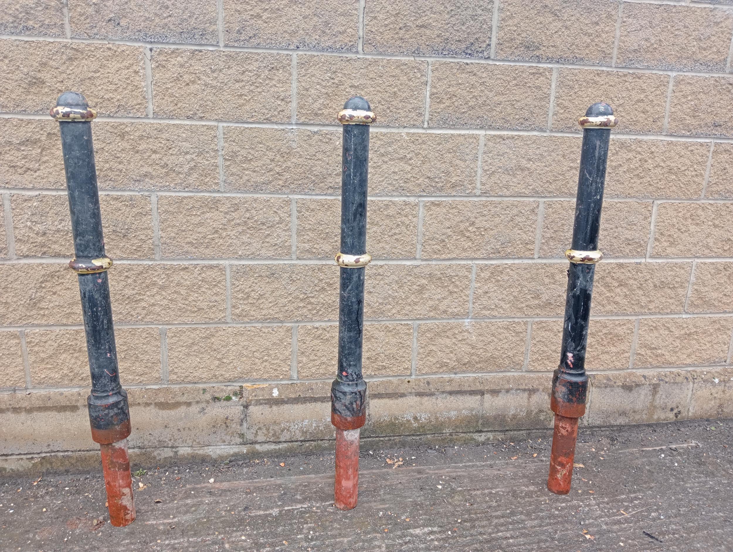 Three cast iron bollards {H 130cm x Dia 12cm }. (NOT AVAILABLE TO VIEW IN PERSON)