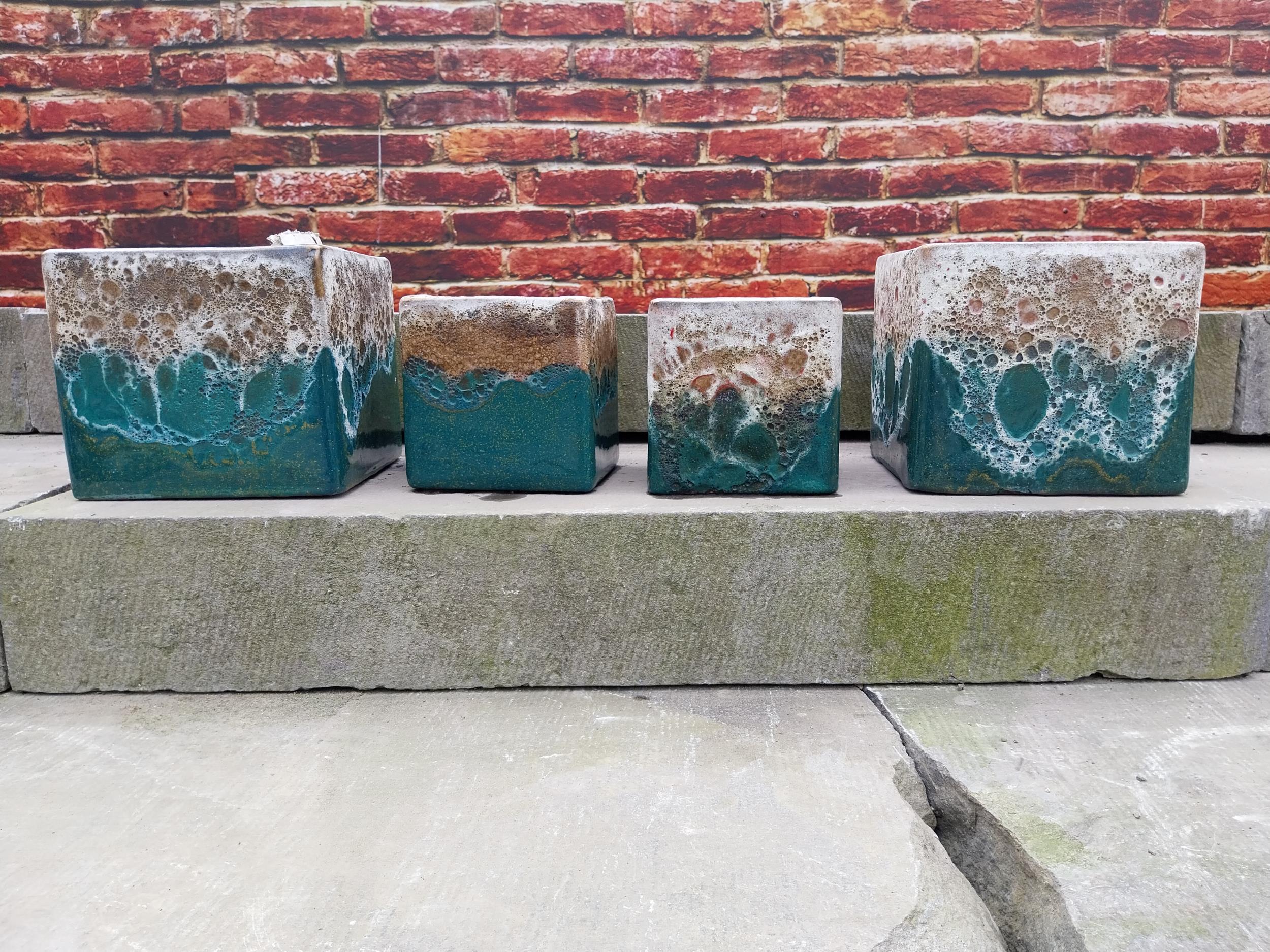 Set of four Atlantis glazed terracotta plant pots {20 cm H x 22 cm W x 22 cm D and 16 cm H x 15 cm W