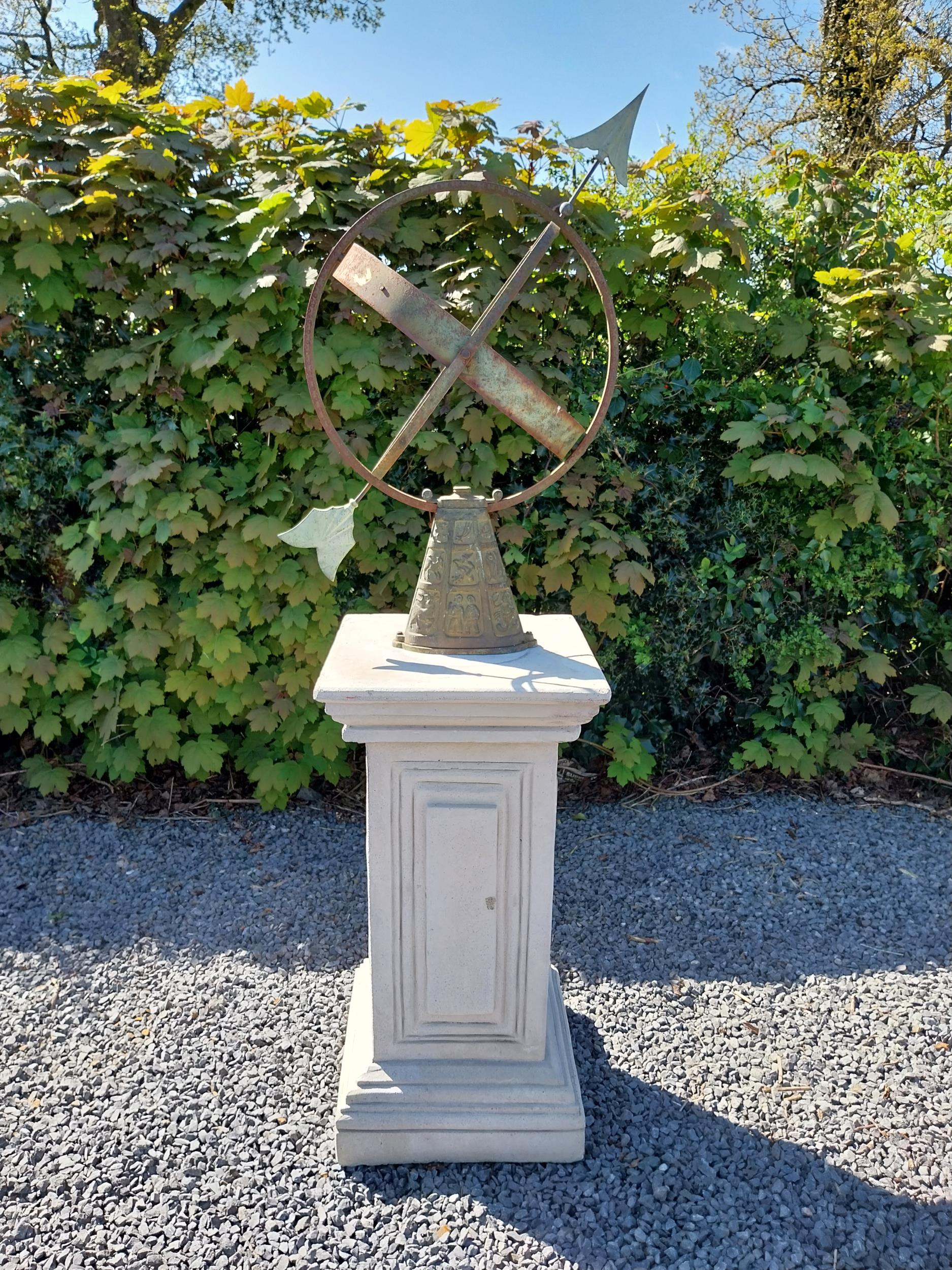 Copper and metal Armorial sundial raised on moulded sandstone pedestal {158 cm H x 40 cm W x 40 cm