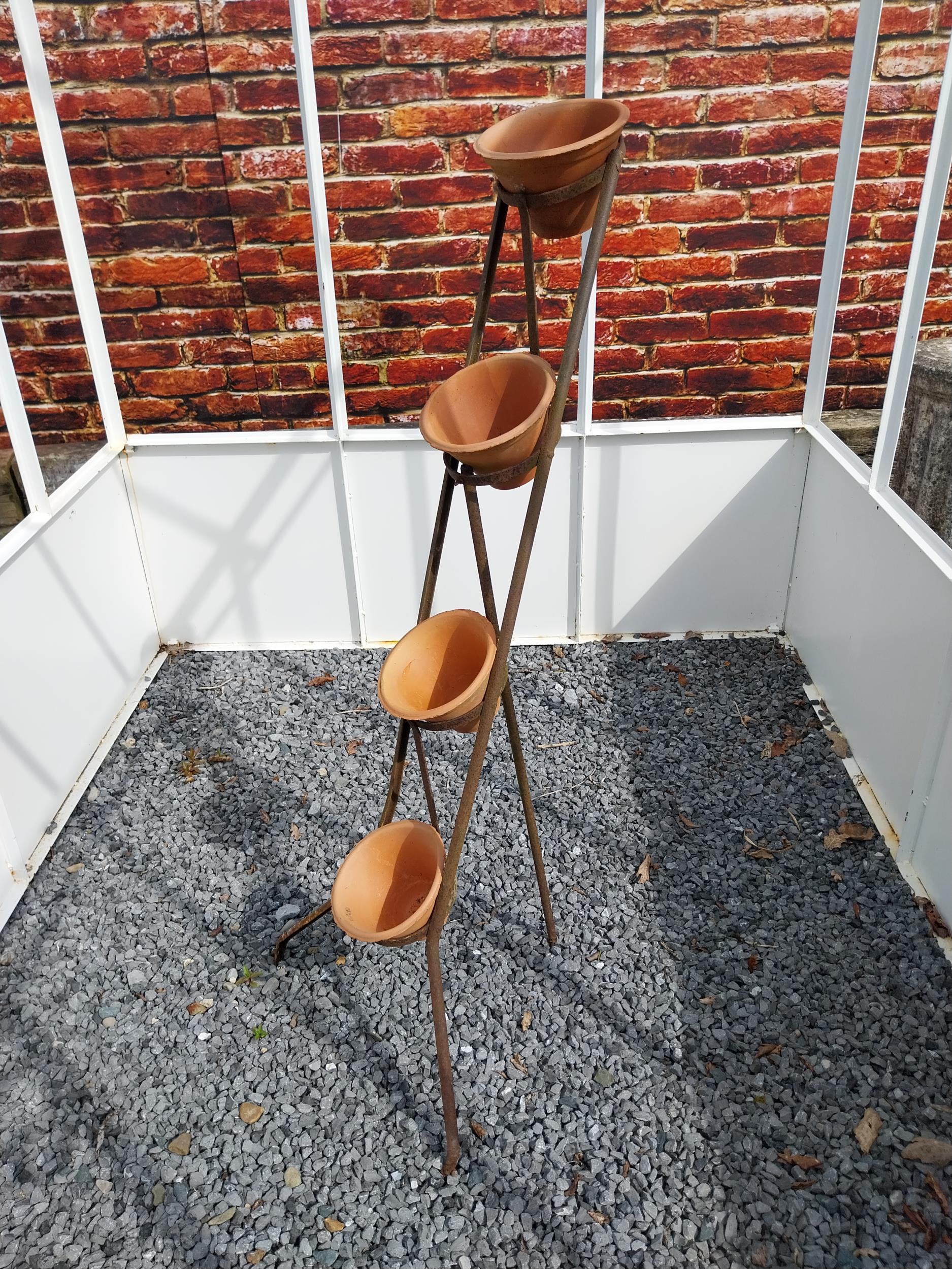 Early 20th C. four tiered wrought iron pot rack with terracotta plant pots {120 cm H x 46 cm W x
