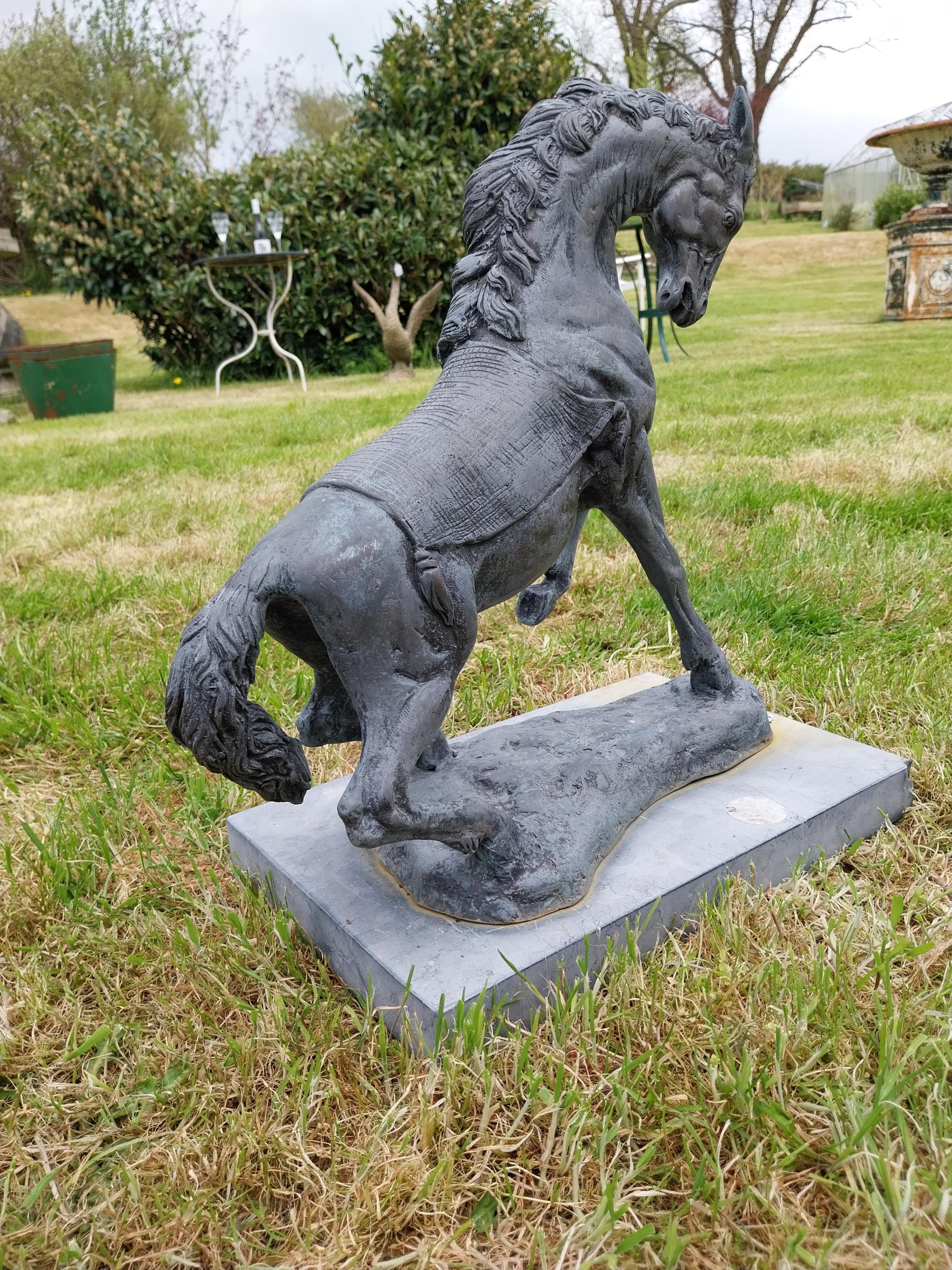 Bronze sculpture of a rearing Horse mounted on slate base {52 cm H x 41 cm W x 26 cm D}. - Image 2 of 6