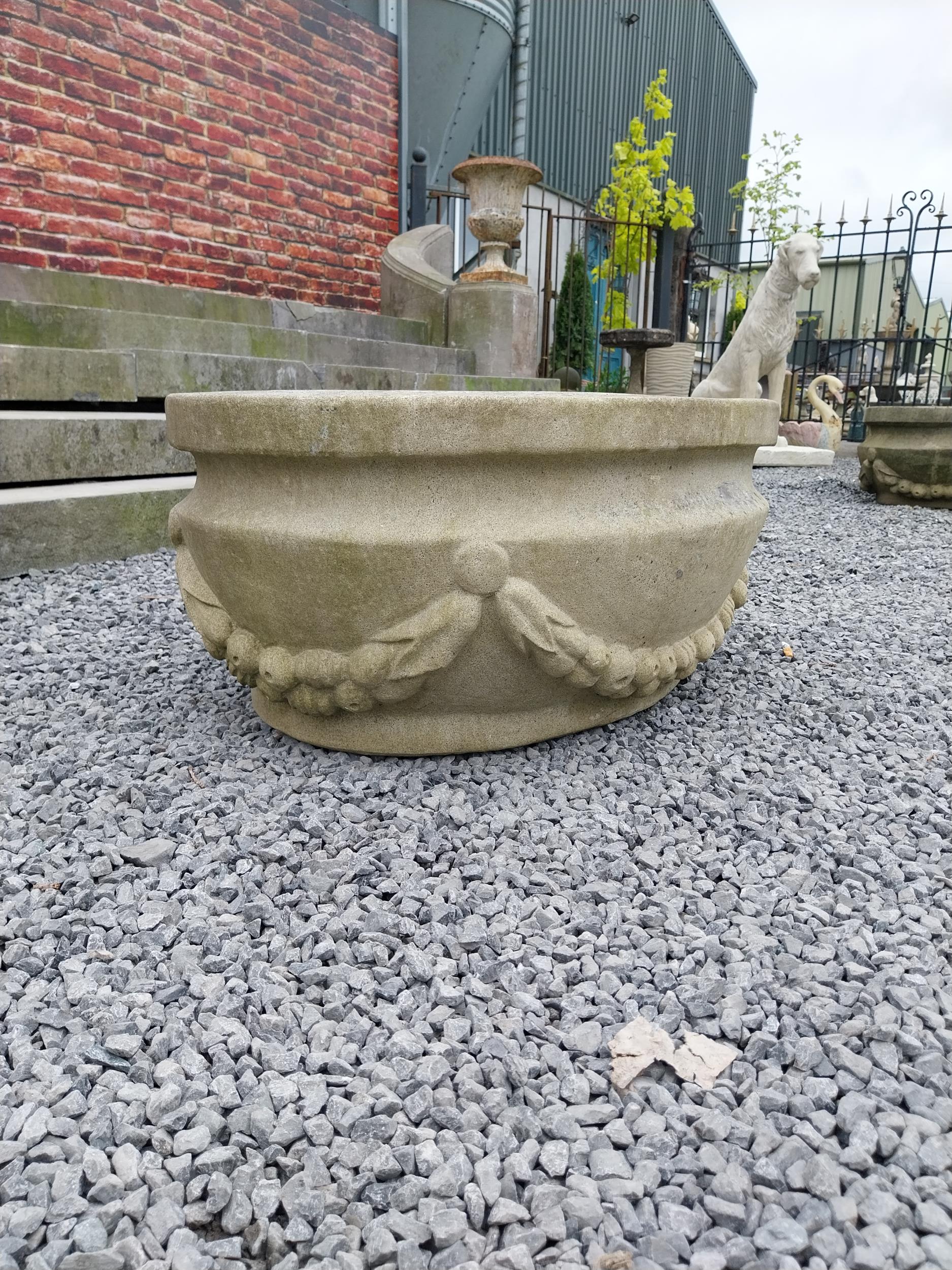 Good quality carved sandstone planter decorated with swags {37 cm H x 80 cm W x 61 cm D}. - Image 3 of 7