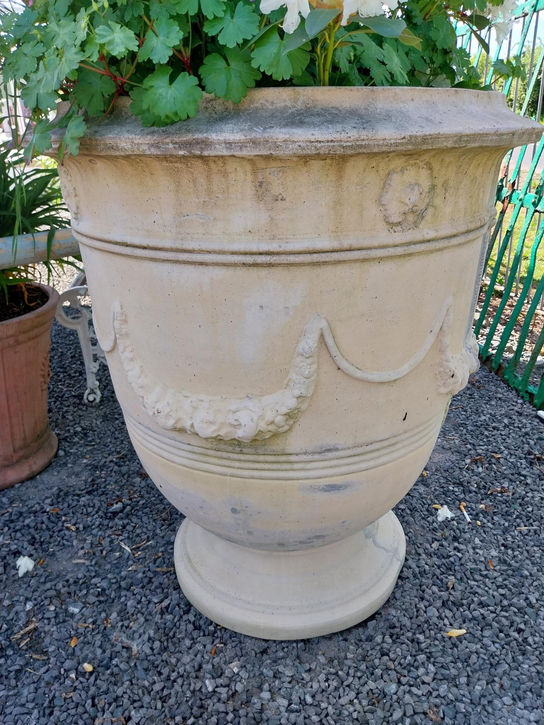 Pair of large moulded sandstone urns decorated with swags including plants {Urns dimensions 100 cm H - Image 5 of 5