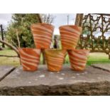 Collection of five terracotta plant pots with spiral design {15 cm H x 16 cm Dia.}.