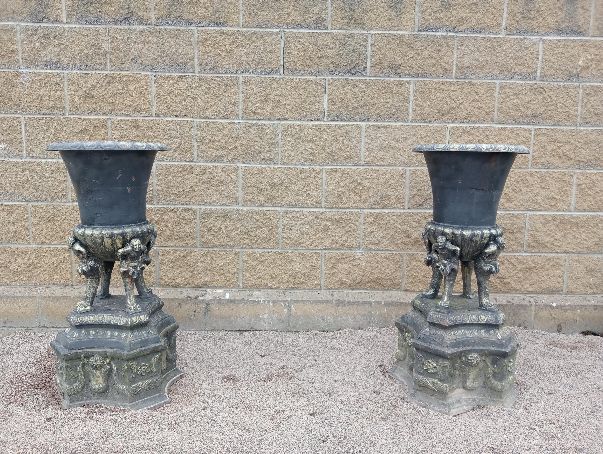 Pair of cast iron urns {H 110cm x W 46cm x D 46cm }. (NOT AVAILABLE TO VIEW IN PERSON)