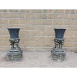 Pair of cast iron urns {H 110cm x W 46cm x D 46cm }. (NOT AVAILABLE TO VIEW IN PERSON)