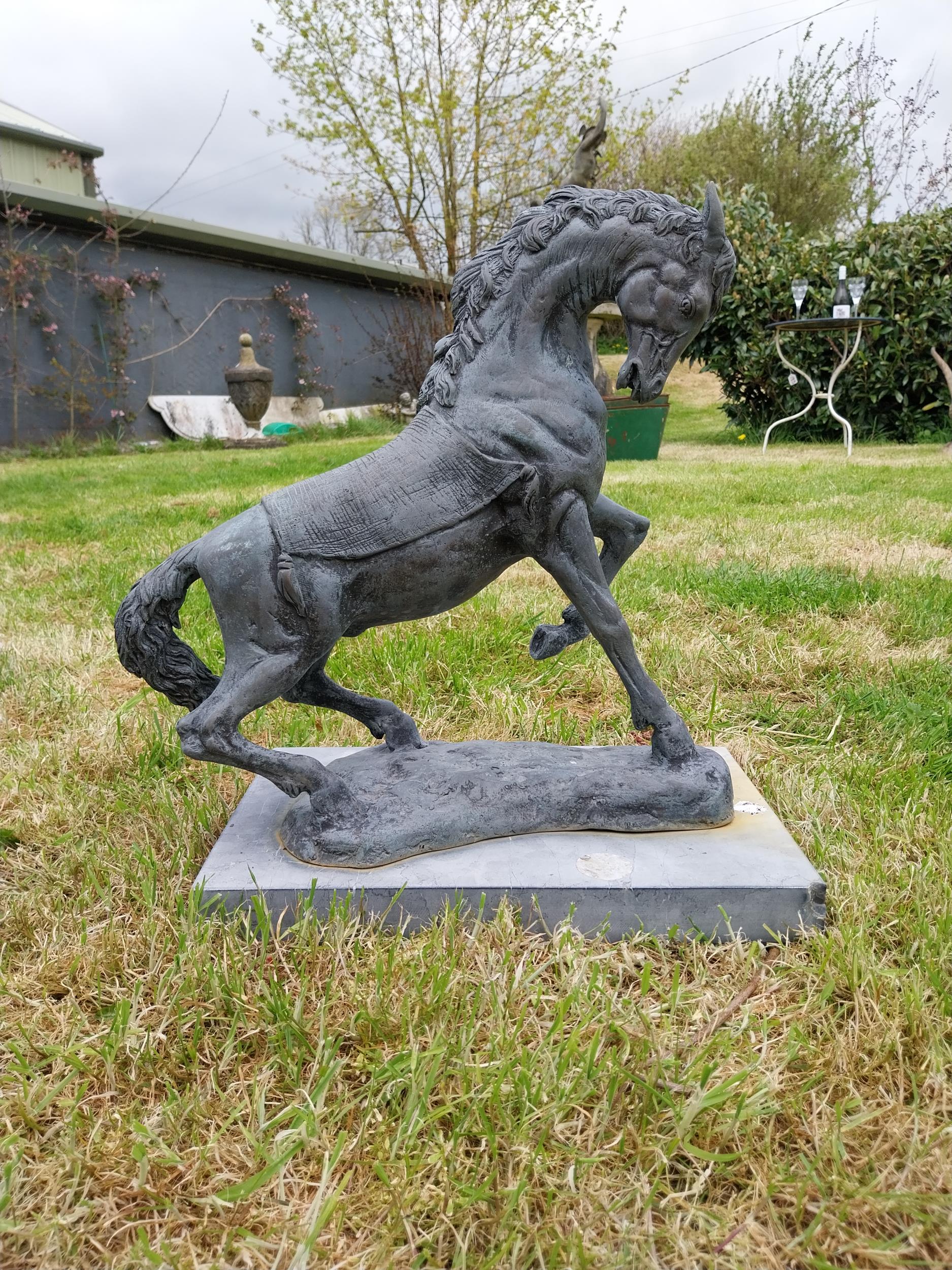 Bronze sculpture of a rearing Horse mounted on slate base {52 cm H x 41 cm W x 26 cm D}.