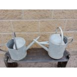 Pair of galvanised watering cans {H 40cm x W 50cm x D 15cm }. (NOT AVAILABLE TO VIEW IN PERSON)