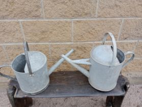 Pair of galvanised watering cans {H 40cm x W 50cm x D 15cm }. (NOT AVAILABLE TO VIEW IN PERSON)