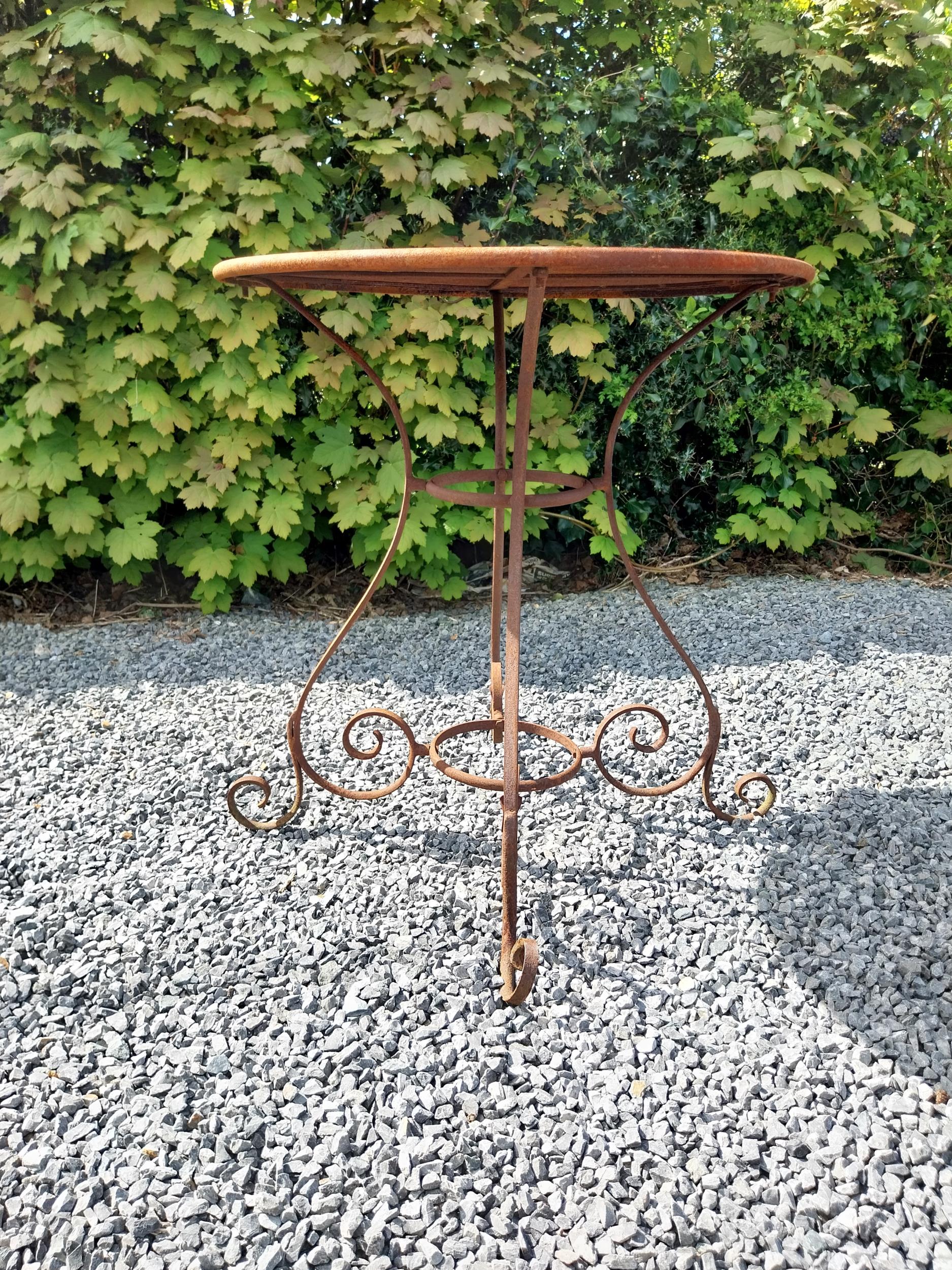 Wrought iron café - garden circular table with two matching chairs {Tbl. 75 cm H x 70 cm Dia. Chairs - Image 8 of 10