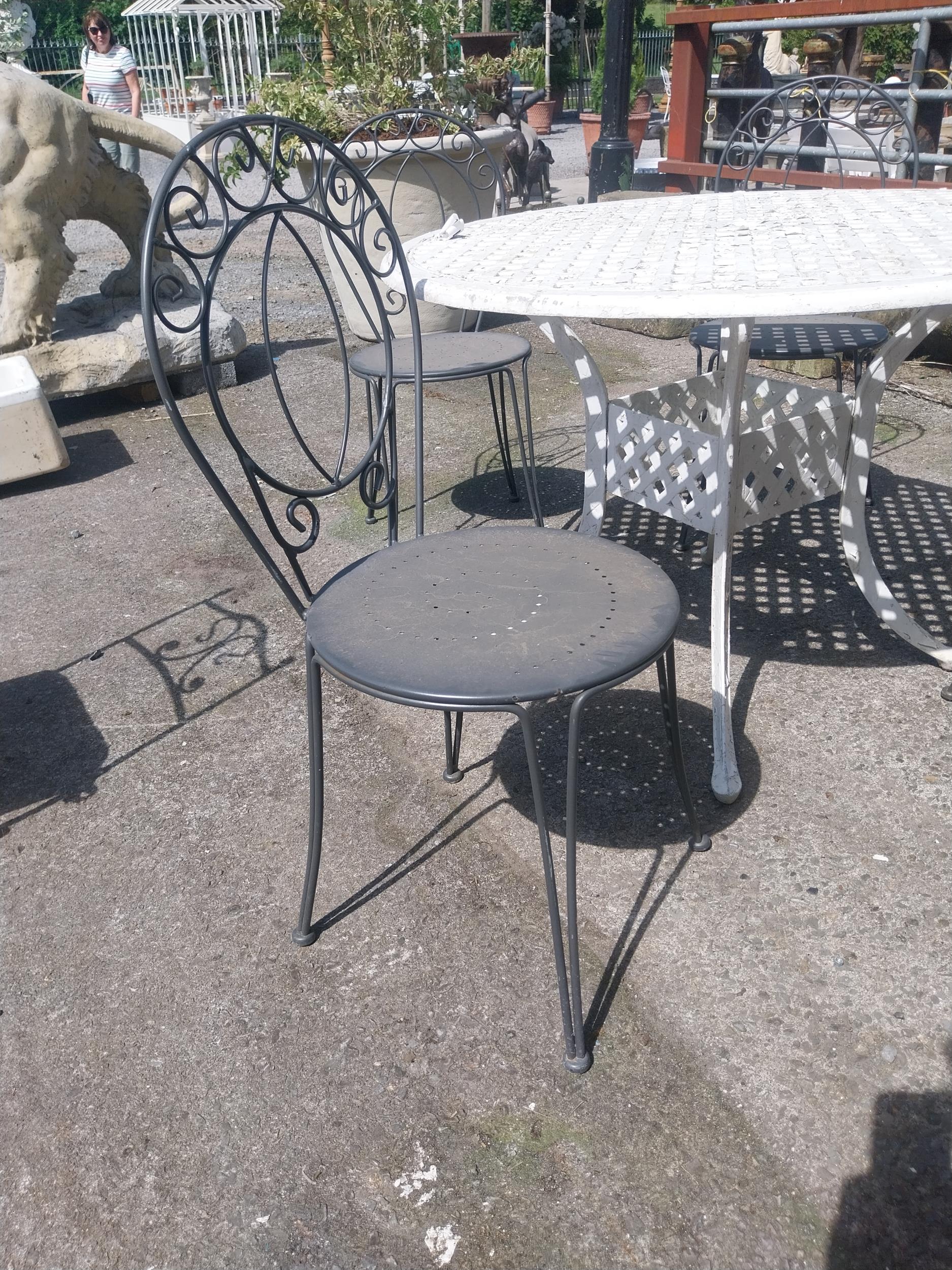 Cast iron aluminium garden table and four wrought iron garden chairs {Tbl. 73 cm H x 106 cm Dia. and - Image 3 of 4