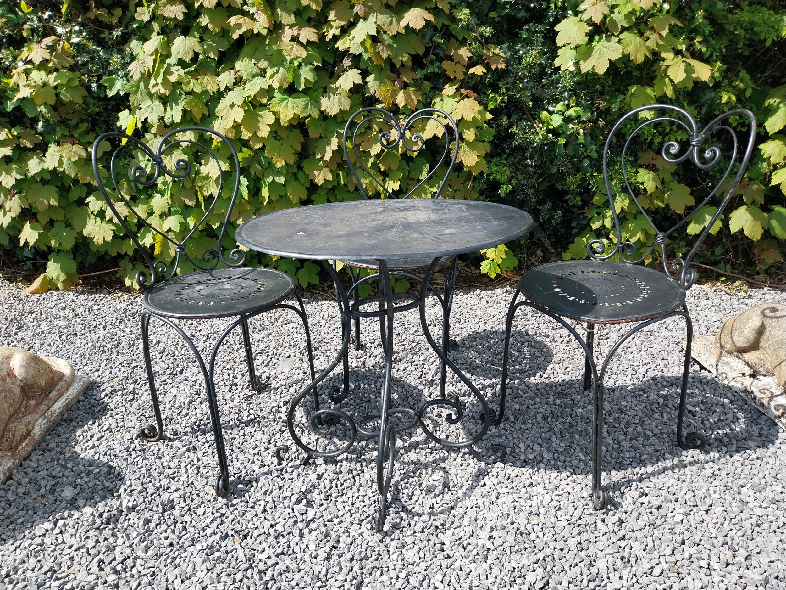 Wrought iron garden table with three matching chairs {Tbl. 65 cm H x 65 cm Dia. and Chairs 82 cm H x