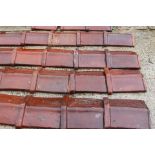 Collection of ninety salt glazed roof tiles includes five corners {H 35cm x W 32cm x D 10cm}. (NOT