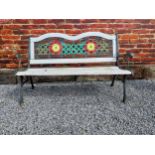 1950s cast iron garden bench with wooden slats decorated with flowers {80 cm H x 128 cm W x 60 cm