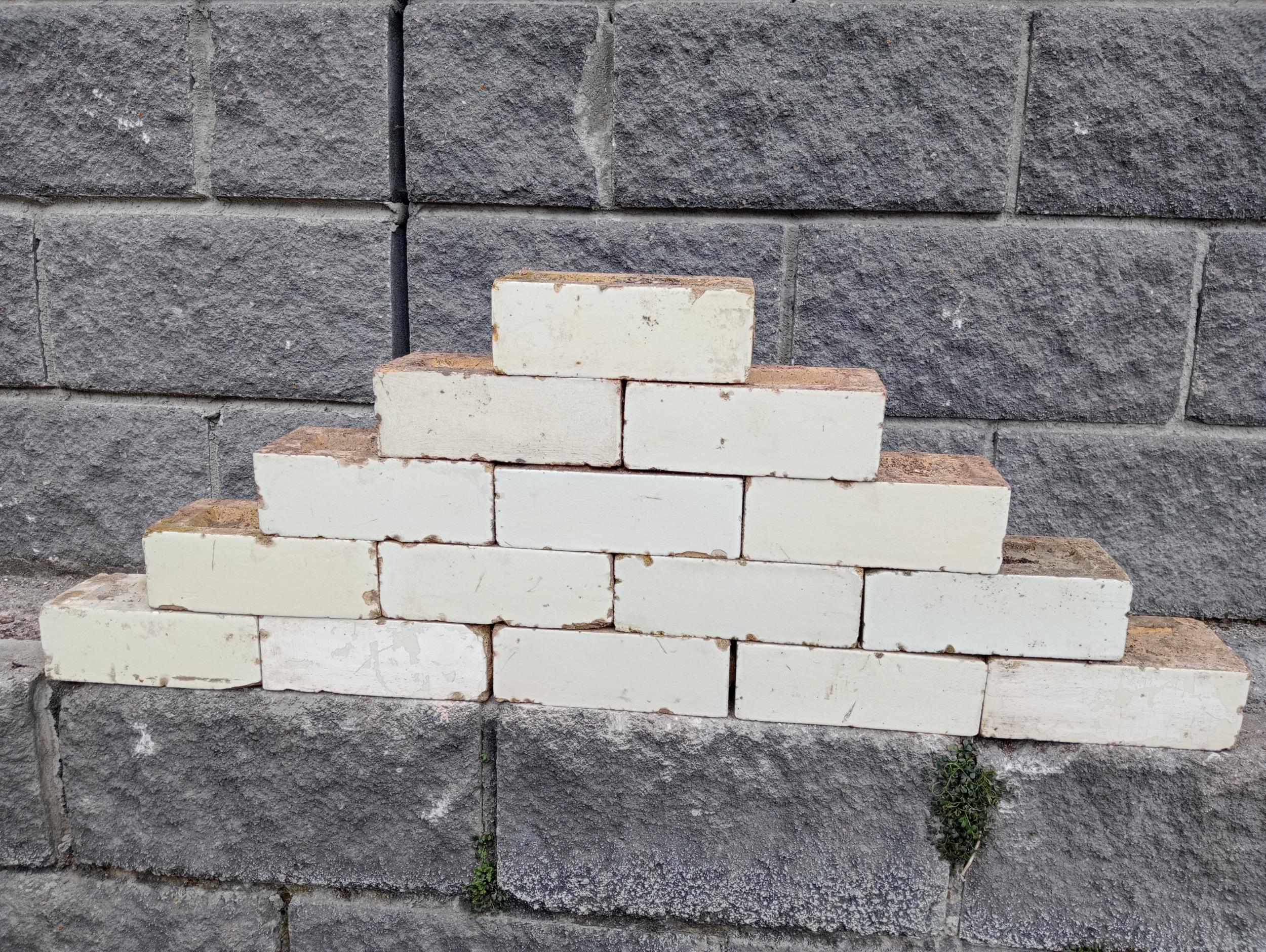 Collection of one hundred white glazed bricks {H 8cm x W 23cm x D 11cm }.
