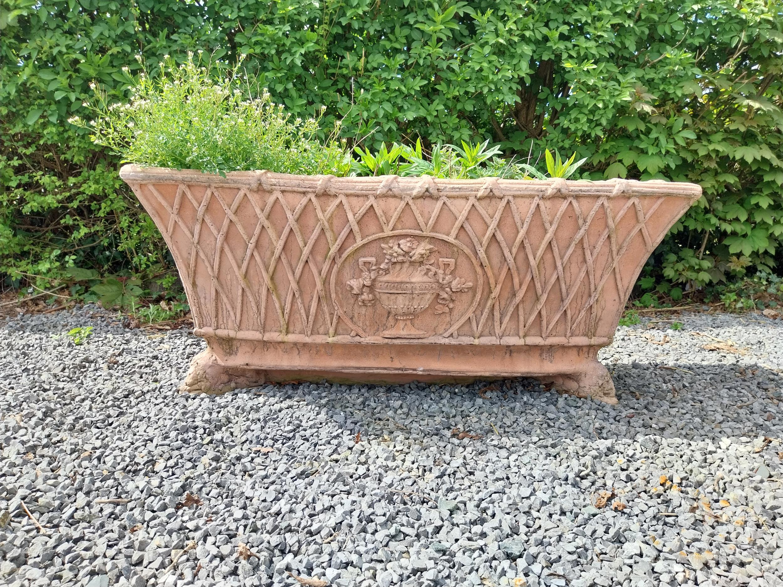 Moulded terracotta rectangular lattice planters on Lions feet {52 cm H x 114 cm W x 56 cm D}.