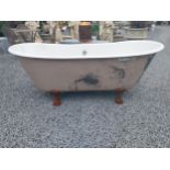 French enamel bath on decorative cast iron lions paw feet {66 cm H x 172 cm W x 86 cm D}.