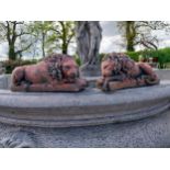 Pair of moulded terracotta statuettes of recumbent Lions {14 cm H x 32 cm W x 11 cm D}.