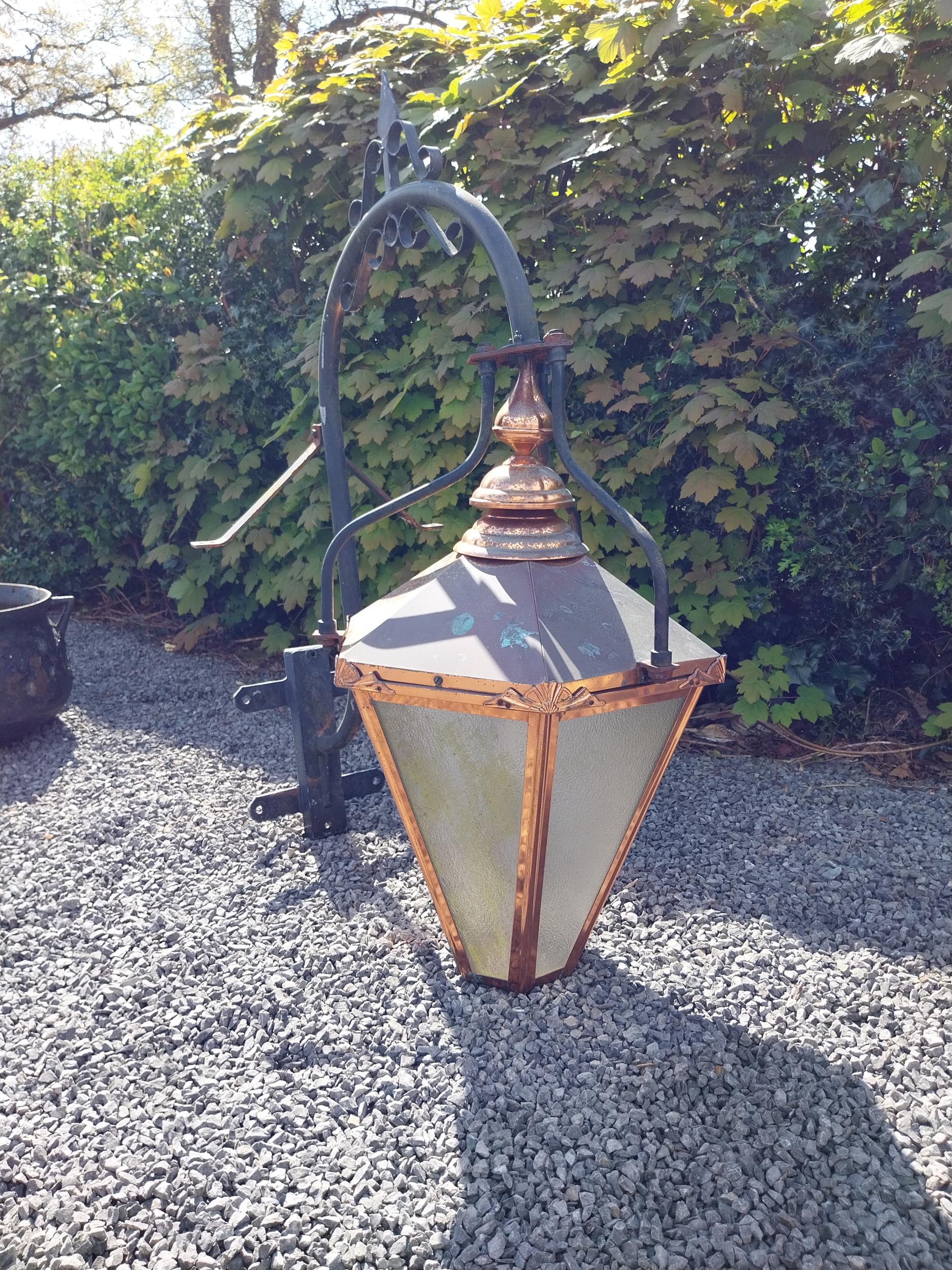 Good quality copper wall lantern with wrought iron bracket {129 cm H x 94 cm W x 54 cm D}. - Image 4 of 9