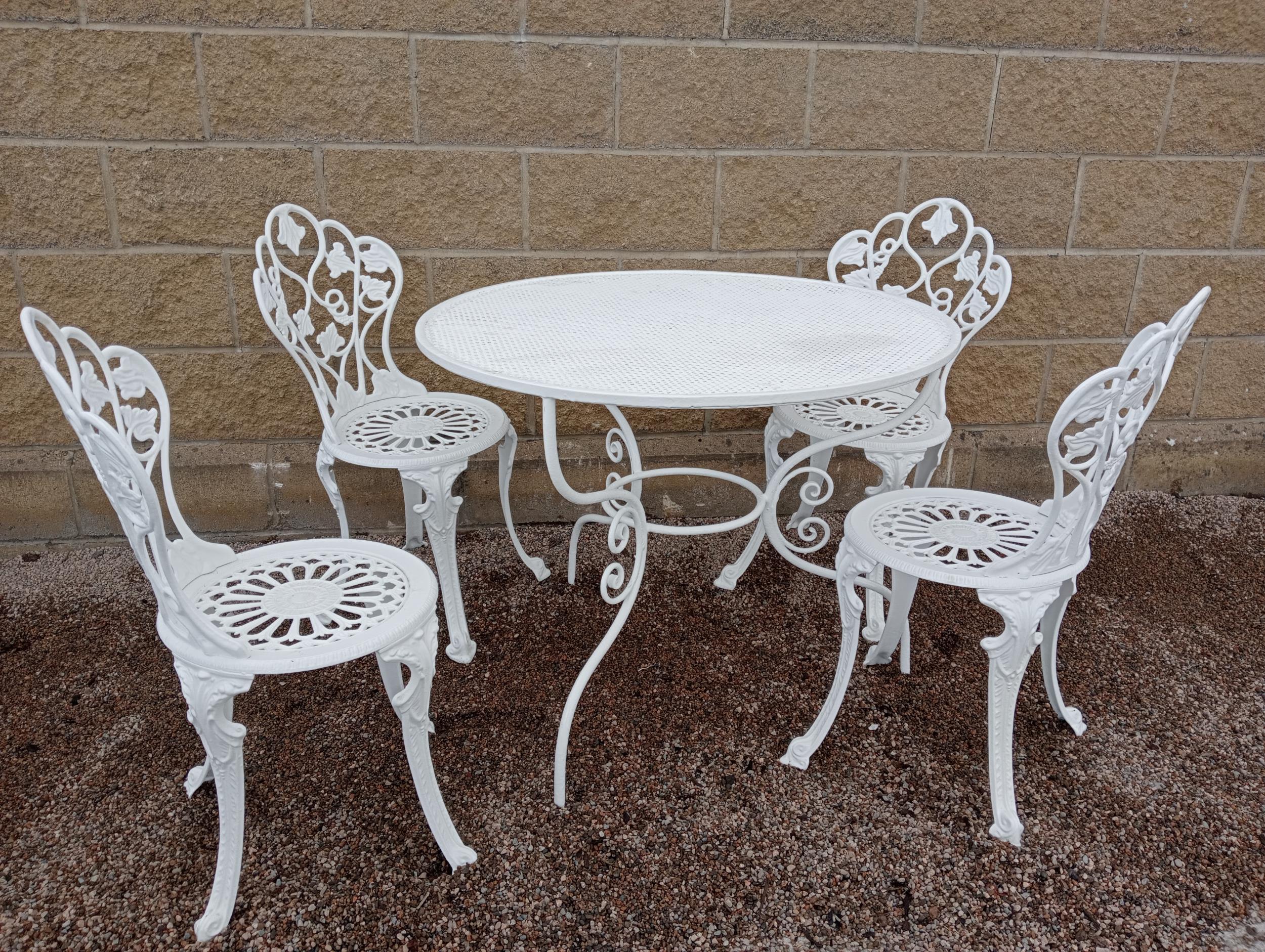 Aluminium garden table and four chairs {Chairs H 84cm x 40 x 40 Table H 72cm x Dia 92cm }. (NOT