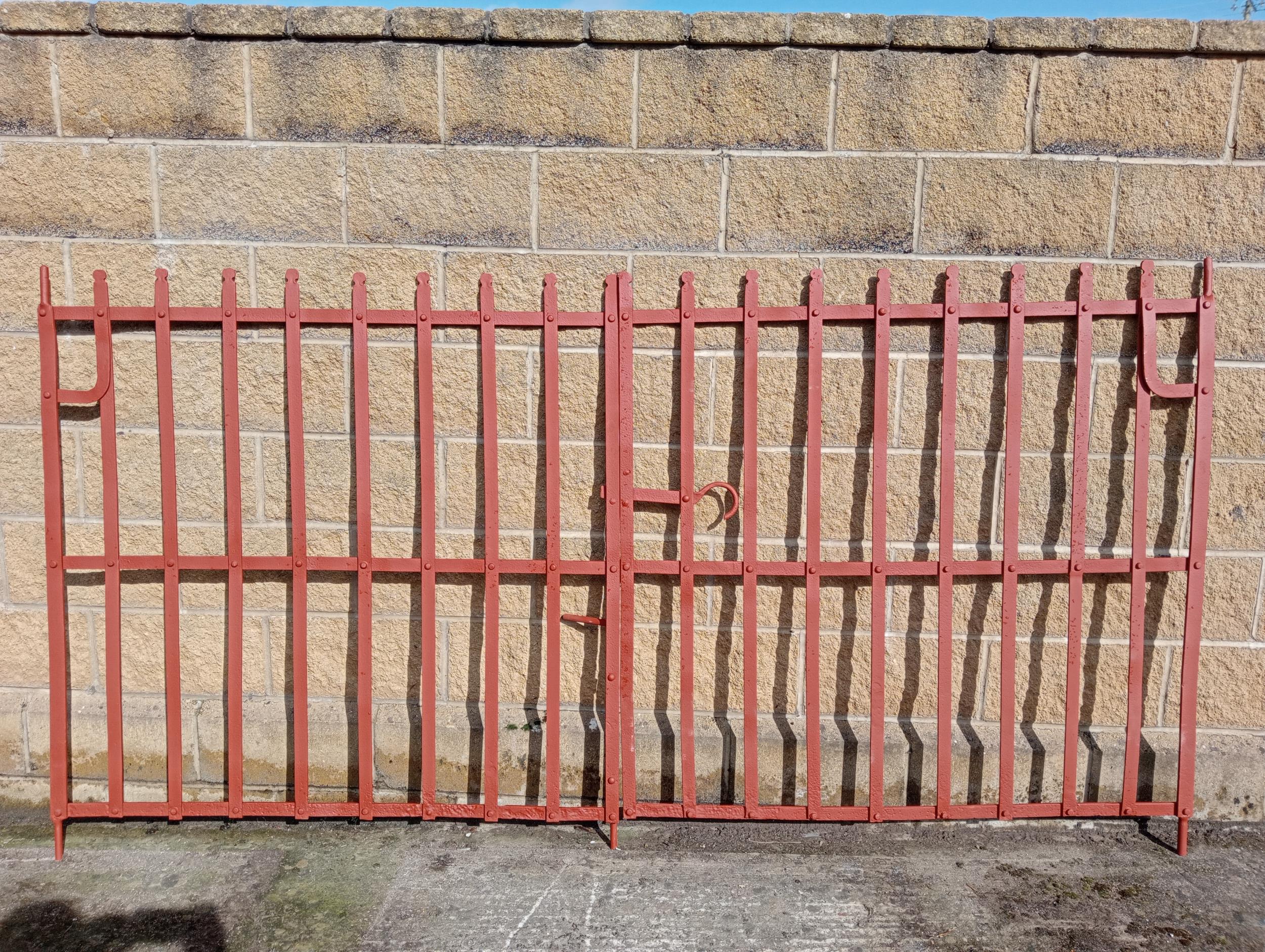 Pair of flat wrought iron entrance gates by Northburn {H 143cm x W 274cm x D 3cm}. (NOT AVAILABLE TO