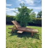 Good quality teak sun lounger {92 cm H x 65 cm W x 200 cm L}.