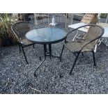 Garden table and two rattan chairs {Table:70cm H x 60cm Dia. And Chairs: 76cm H x 54cm W x 56cm D}