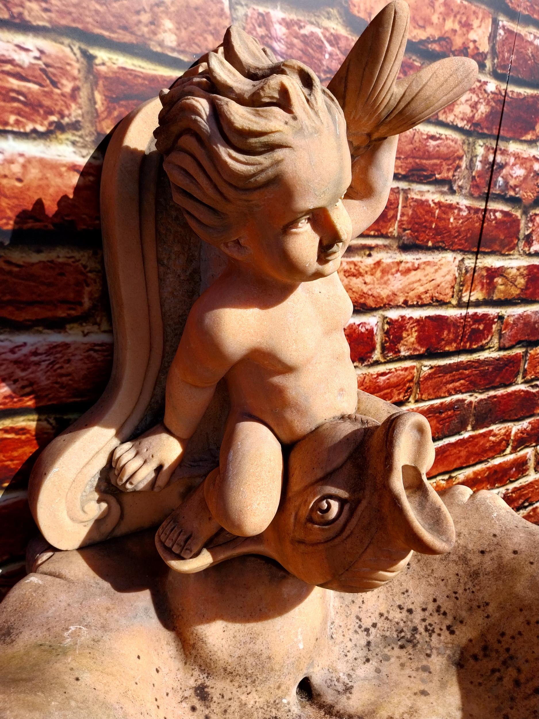 Pink marble wall fountain decorated with fish and boy {137 cm H x 70 cm W}. (NOT AVAILABLE TO VIEW - Image 6 of 9