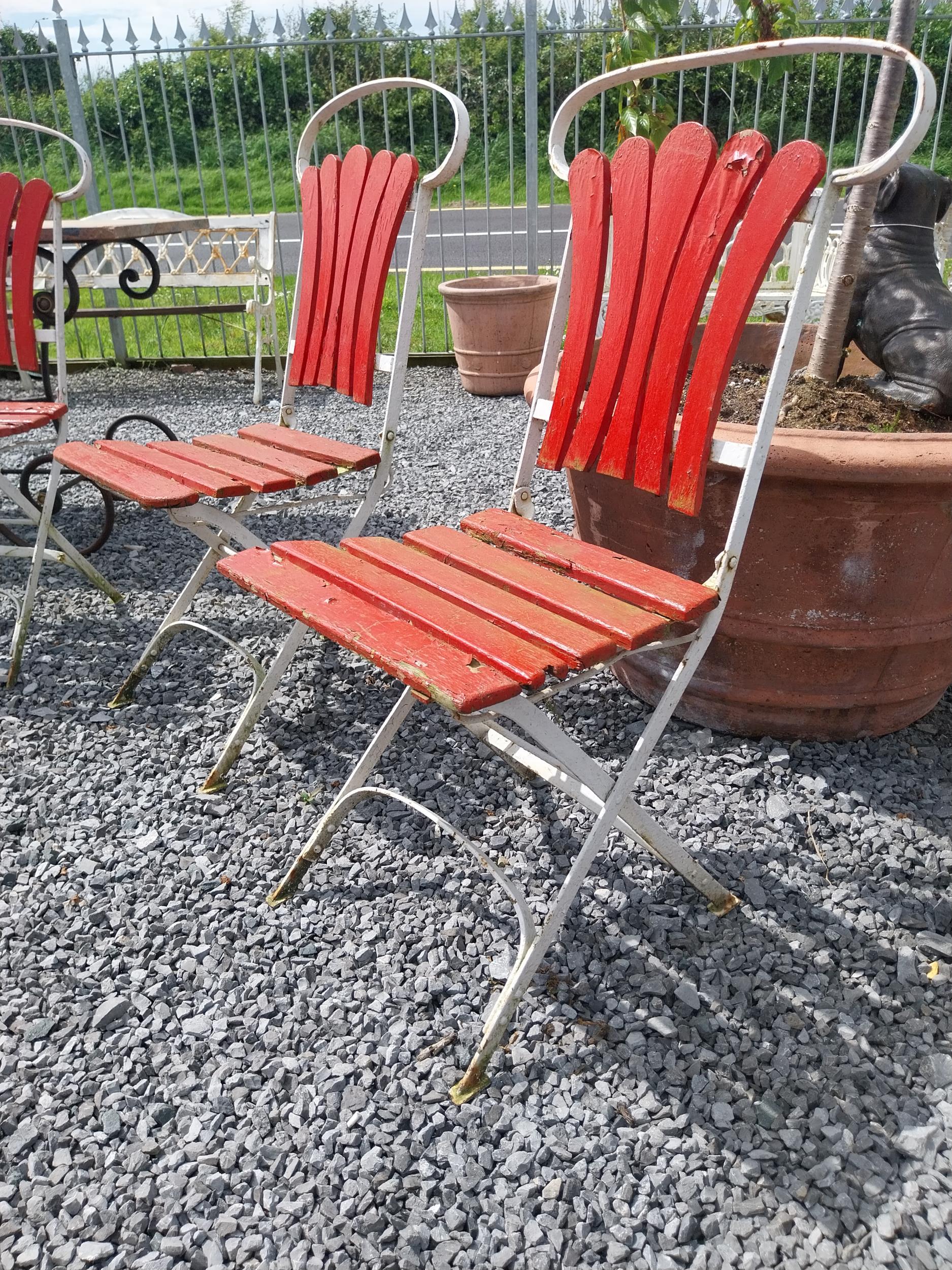 Set of four early 20th C. wrought iron folding garden chairs with wooden slats {90 cm H x 44 cm W - Image 2 of 3