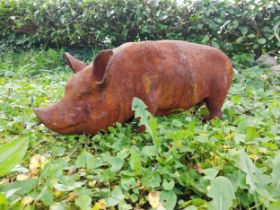 Good quality cast iron statue of a Pig {29 cm H x 70 cm W x 20 cm D}.