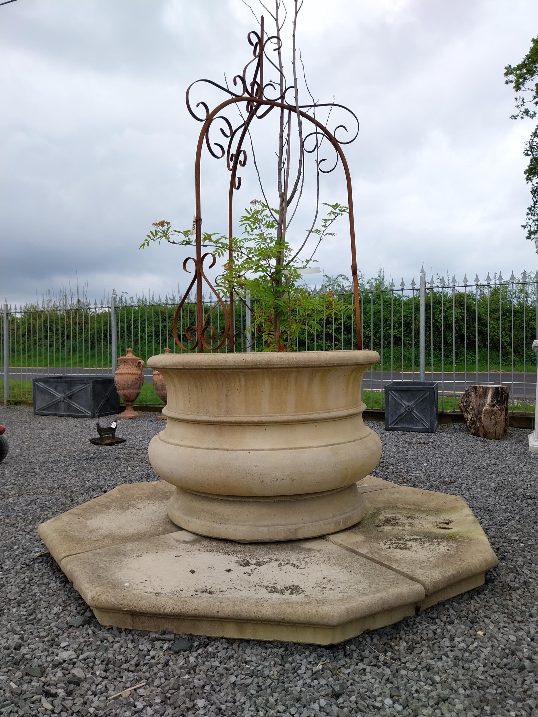 Good quality moulded sandstone well head with platform base and wrought iron arch {224 cm H x 180 cm