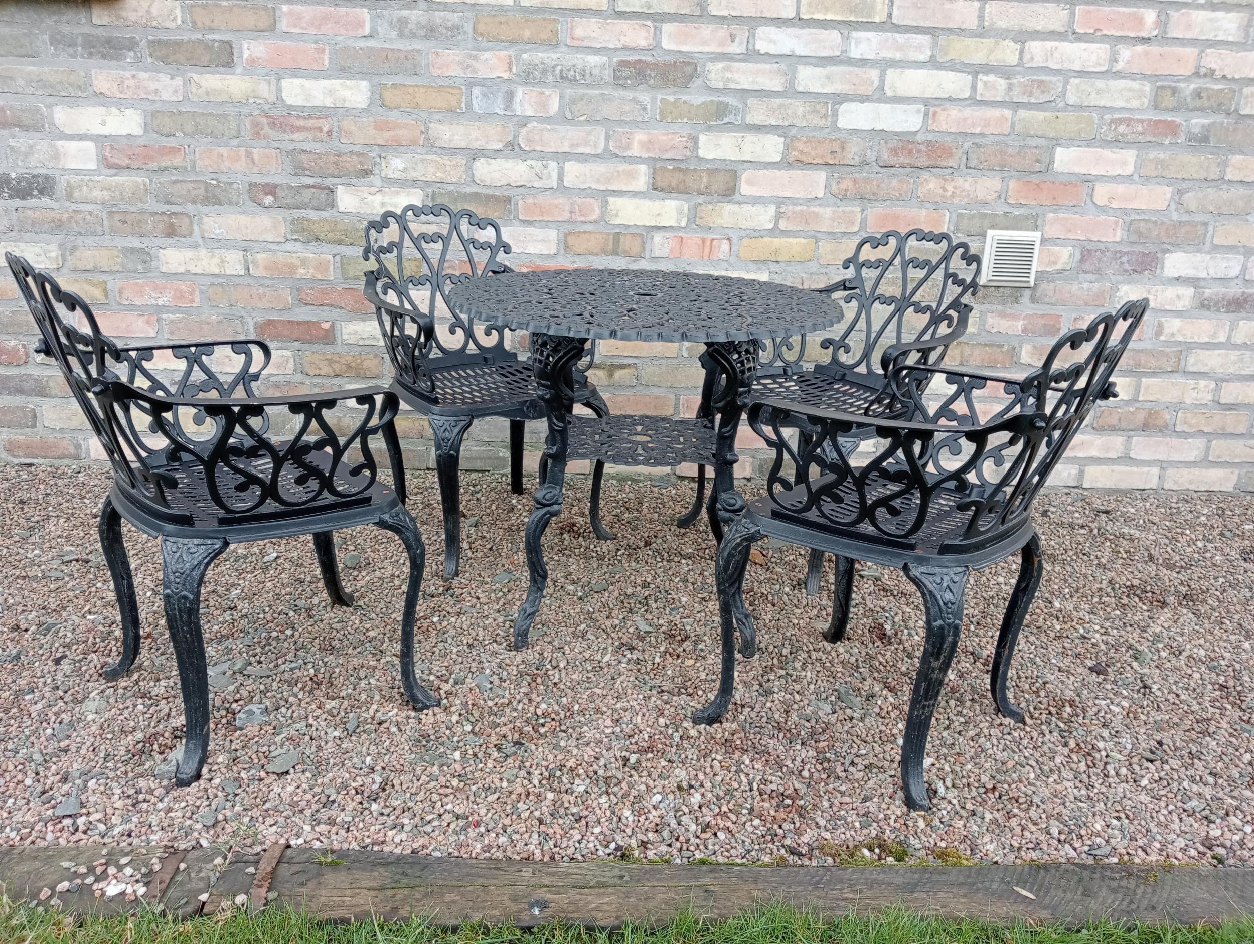 Cast aluminium black garden table four armchairs {Chairs H 80cm x W 58cm x D 50cm Table H 69cm x Dia