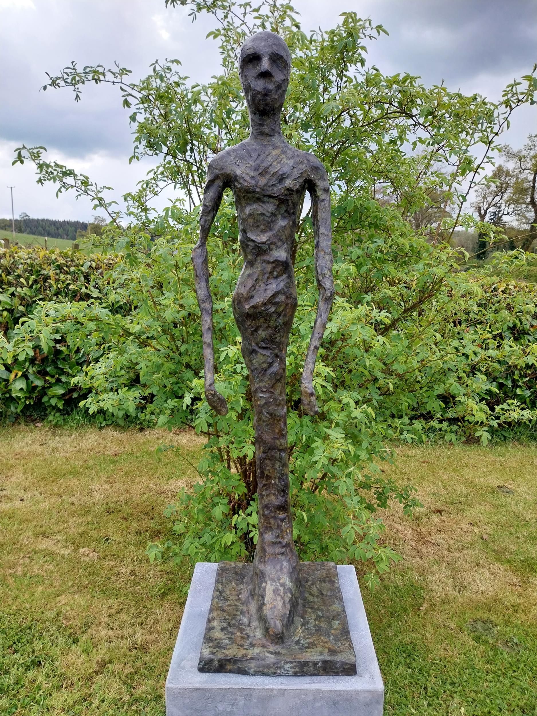 Exceptional quality contemporary bronze sculpture of a Man raised on slate plinth {Overall - Image 2 of 9