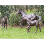 Pair of bronze statues of foals {H 100cm x W 120cm x D 30cm}. (NOT AVAILABLE TO VIEW IN PERSON)