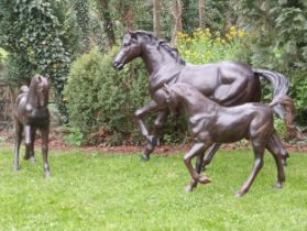 Pair of bronze statues of foals {H 100cm x W 120cm x D 30cm}. (NOT AVAILABLE TO VIEW IN PERSON)