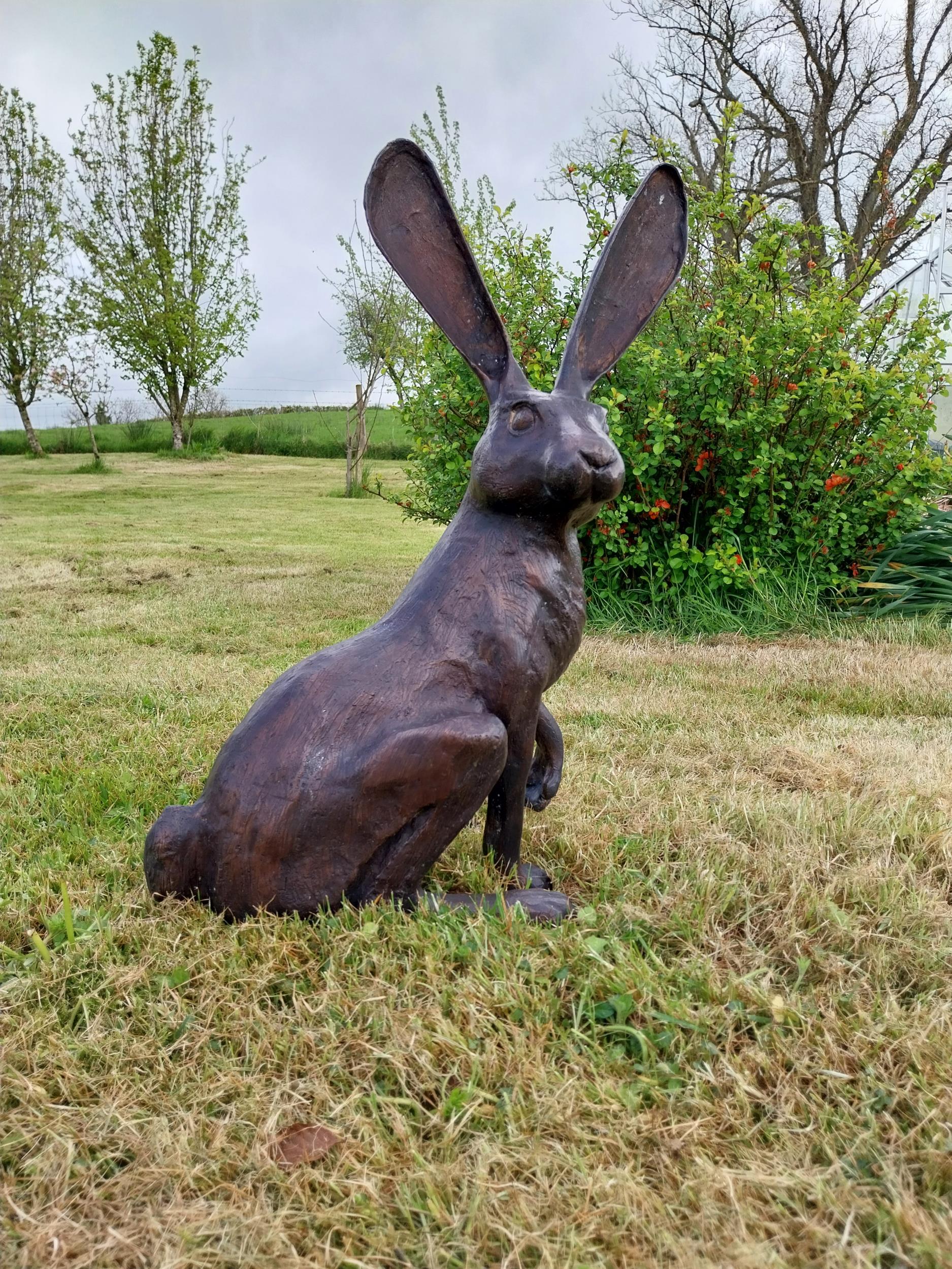 Exceptional quality bronze statue of a seated Hare with ears up {61 cm H x 35 cm W x 20 cm D}.