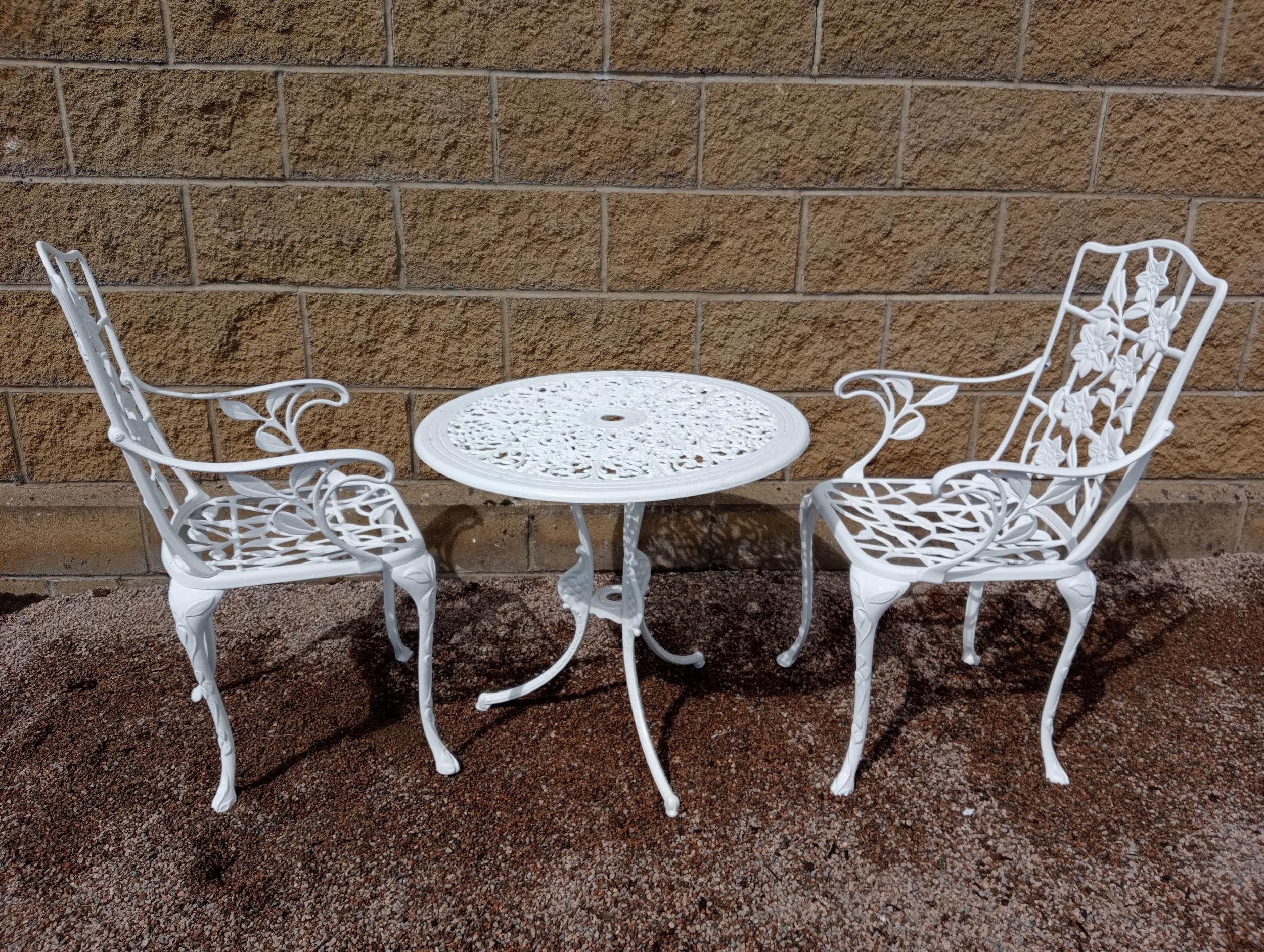 Aluminium garden table and two armchairs {Table H 60cm x Dia 70cm Chairs H 90cm x W 54cm x D 44cm }.