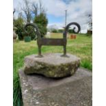 Wrought iron boot pull mounted on stone base {32 cm H x 30 cm W x 24 cm D}.