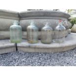 Collection of four glass demijohns {36 cm H x 16 cm Dia.}.