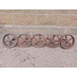 Collection of five cast iron shepherd hut wheels {Dia 24cm x D 7cm }. (NOT AVAILABLE TO VIEW IN