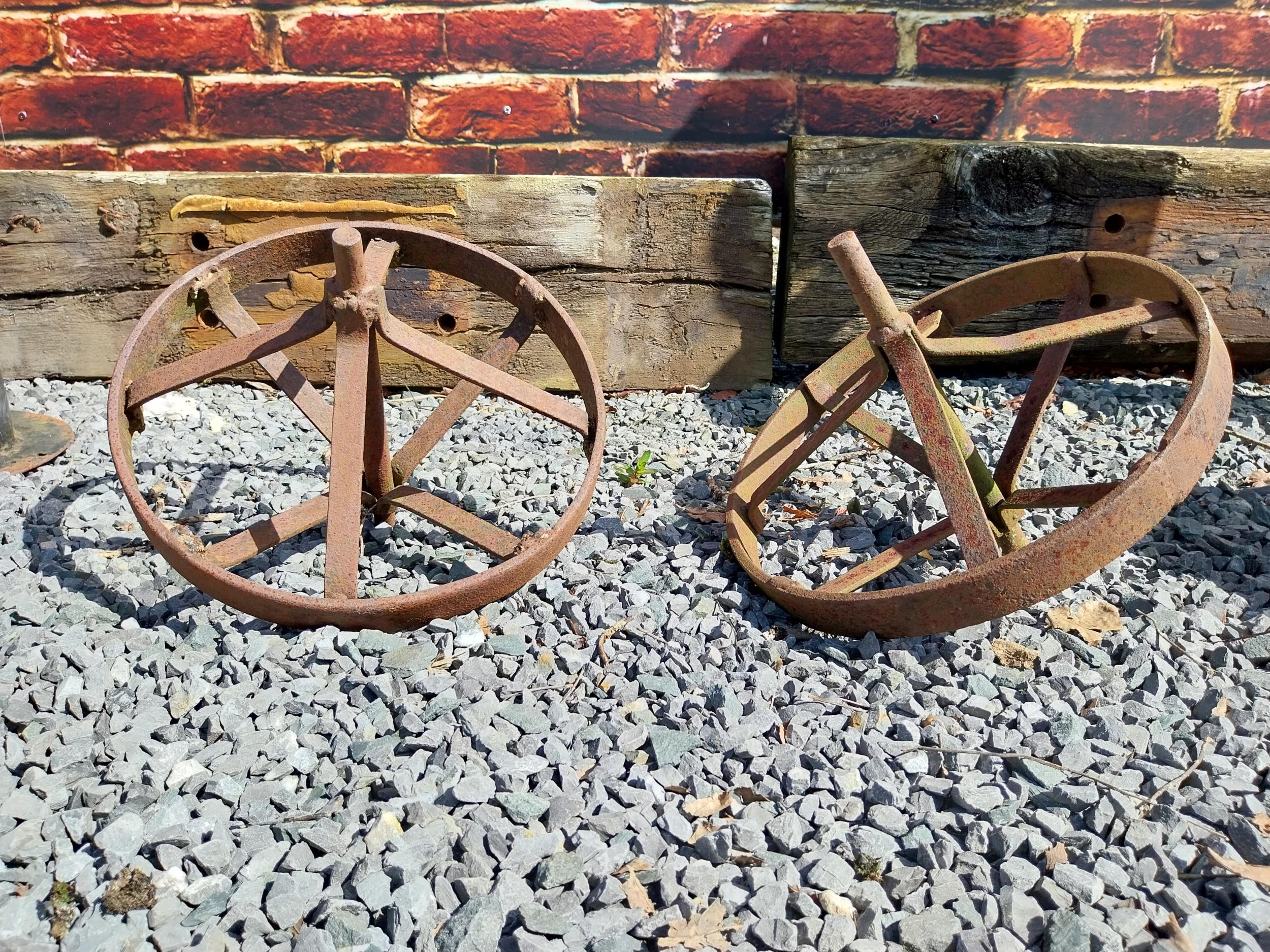 Pair of cast iron wheel barrow wheels {33 cm W x 34 cm Dia.}.