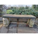 Composition stone bench raised on pedestals in the form of Griffins {H 44cm x W 120cm x D 38cm }. (