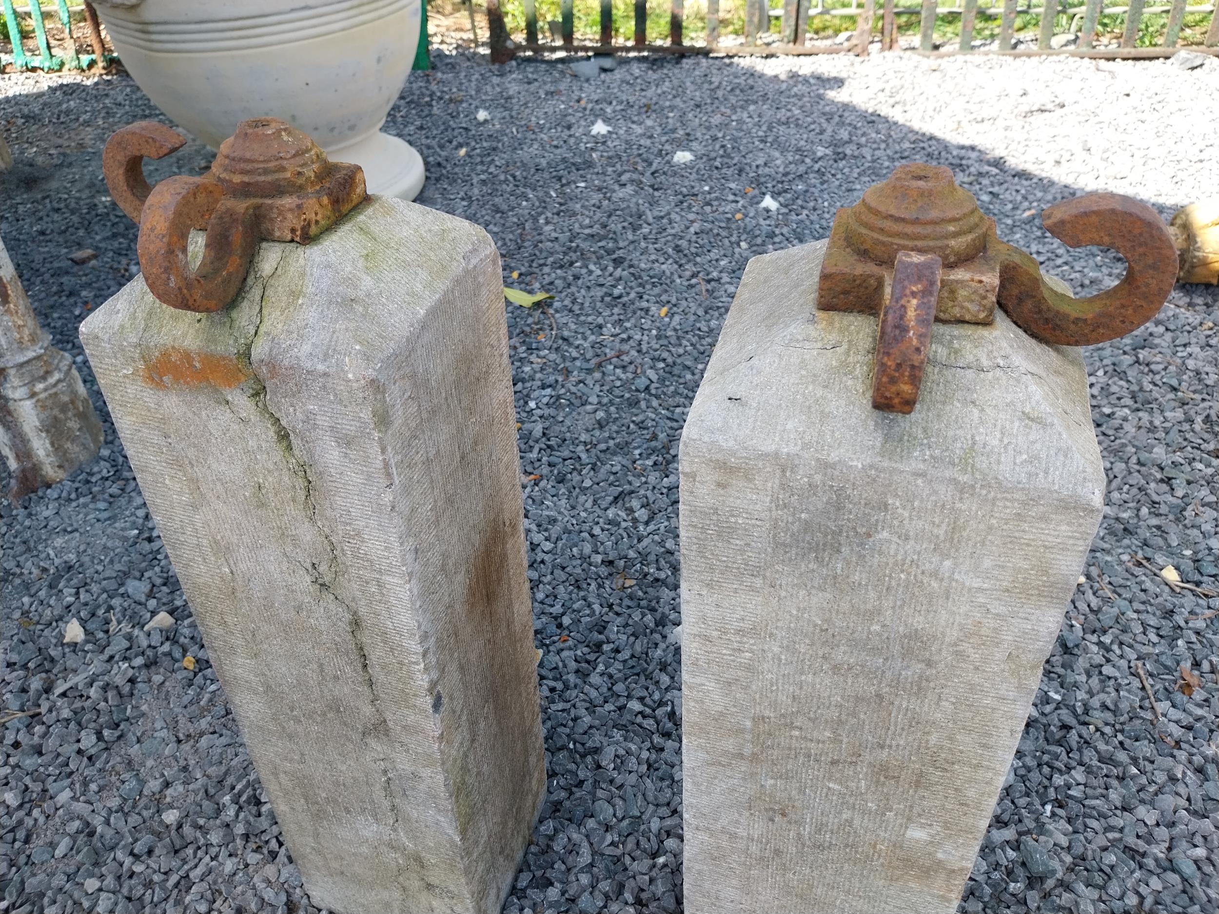 Pair of 19th C. hand-cut limestone bollards with wrought iron tops {72 cm H x 21 cm W x 21 cm D}. - Image 2 of 3