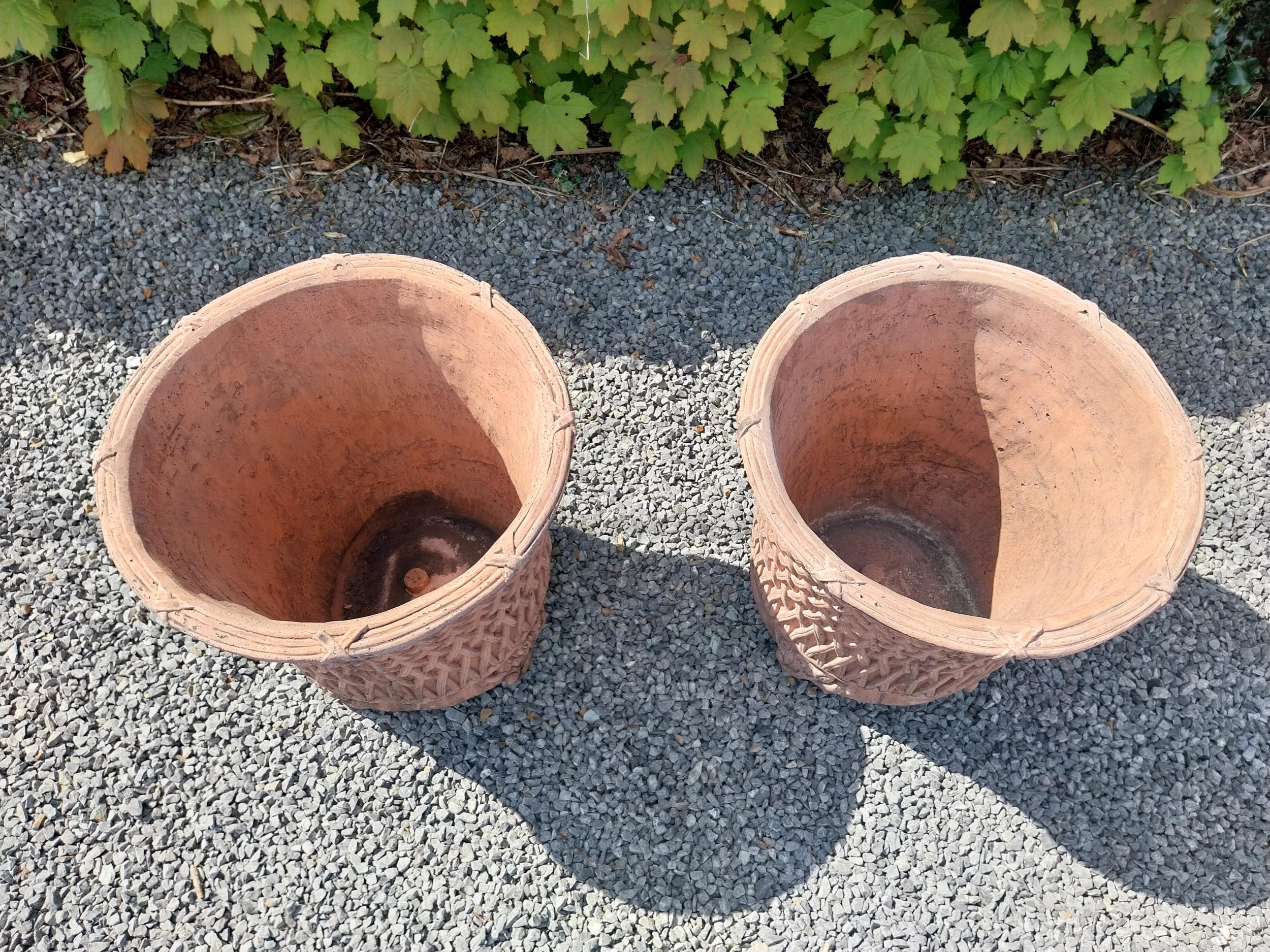 Pair of moulded terracotta circular lattice urns {53 cm H x 54 cm Dia.}. - Image 2 of 6