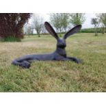 Exceptional quality bronze statue of a lying Hare with ears up {61 cm H x 35 cm W x 20 cm D}.