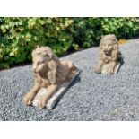 Pair of re-constituted stone statues of recumbent Lions {50 cm H x 87 cm W x 31 cm D}.