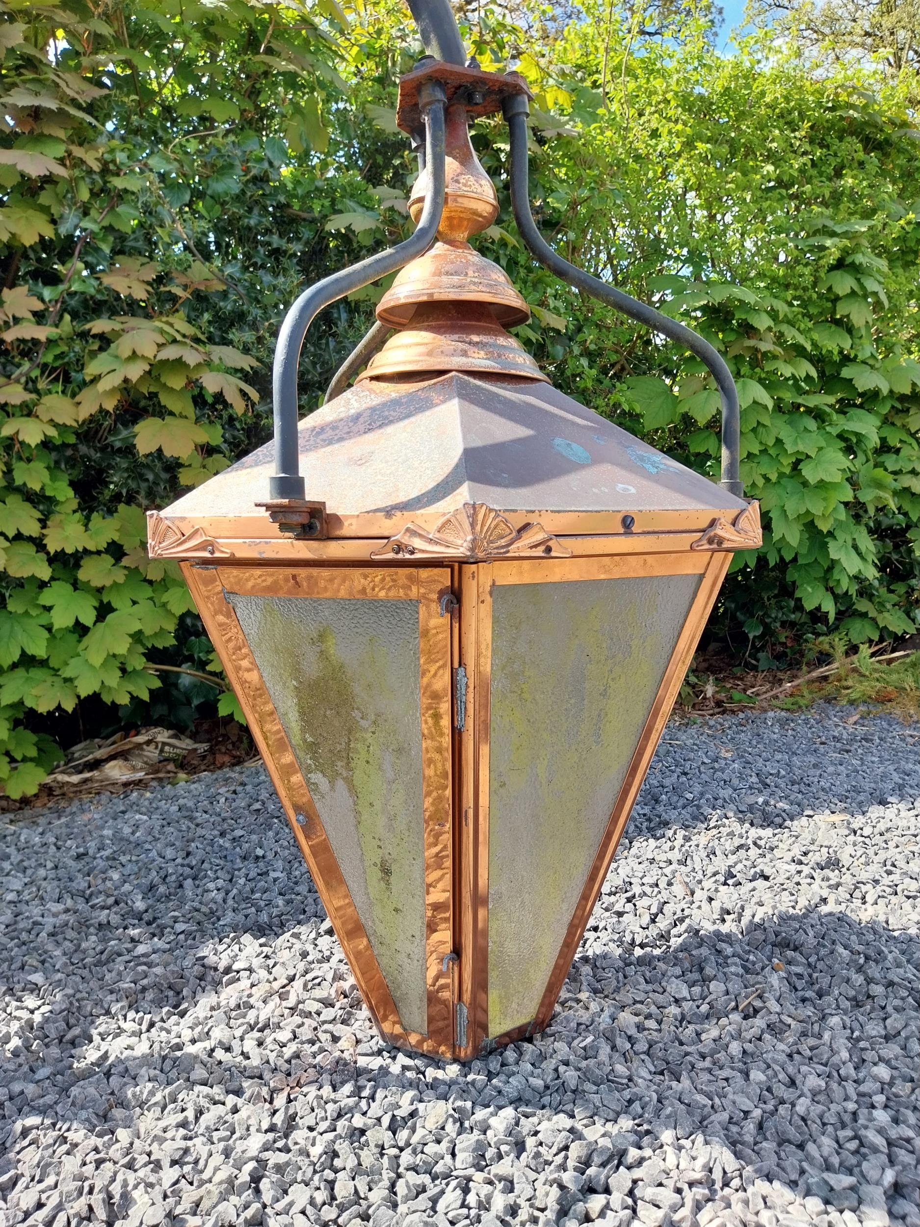 Good quality copper wall lantern with wrought iron bracket {129 cm H x 94 cm W x 54 cm D}. - Image 2 of 9